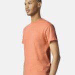 Man looking in another direction wearing Gildan Heavy Cotton t-shirt in tangerine color