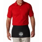 Restaurant worker wearing a custom Liberty Bags three-pocket waist apron with multicolor company logo