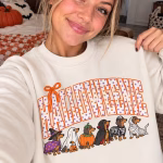 Woman showing off the Halloweenie Dachshund Sweater made by Hollywood Prints