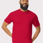 Man with beard wearing a red Gildan softstyle short sleeve t-shirt.