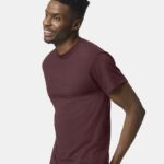 Man posing wearing a dark maroon Gildan Dryblend 50/50 short sleeve t-shirt.