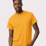 Man wearing a gold Gildan Dryblend 50/50 short sleeve t-shirt.