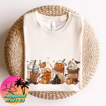 Folded shirt showing an assortment of coffees surrounded by desserts that are halloween related and tiny ghosts