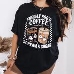 Woman wearing Freshly Boo’d Coffee Halloween Shirt as oversize tee for Halloween