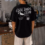 Cool dads club shirt in black variant being worn by man
