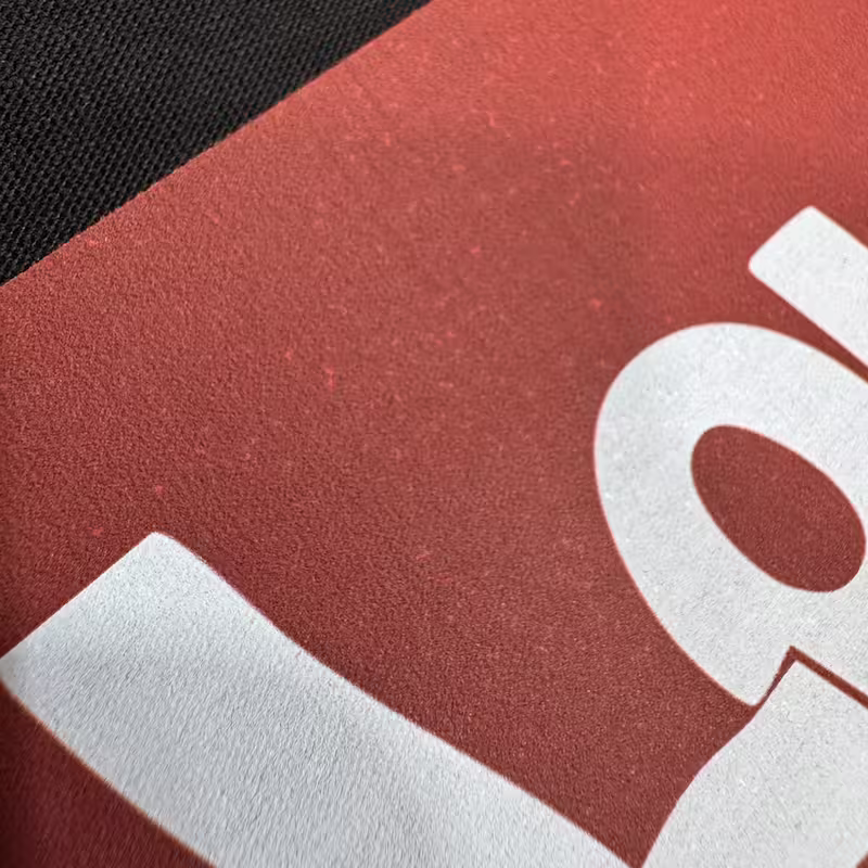 White specks in DTF prints visible inside a red transfer after curing and heat pressing