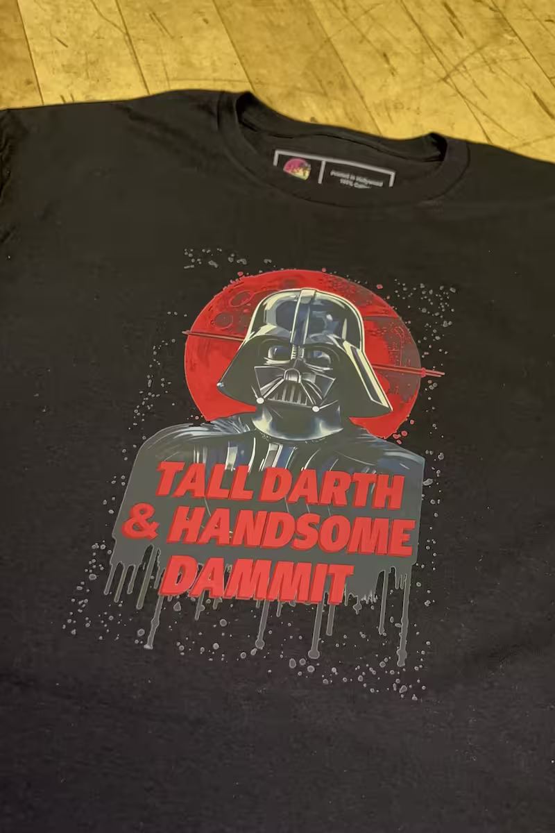 DTF transfer applied to black cotton shirt with bright white underbase and vibrant colors